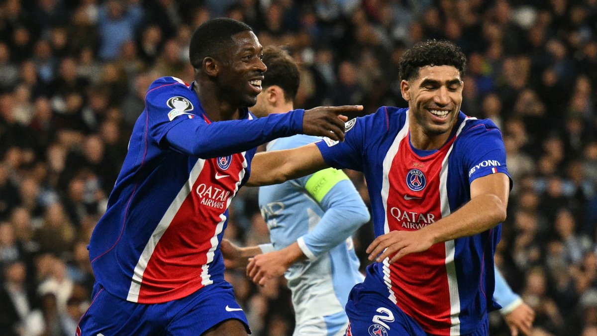 Paris Saint-Germain's Ousmane Dembele (L) celebrates with Achraf Hakimi after scoring their second goal in the UEFA Champions League league-phase match against Manchester City at the Etihad Stadium, Manchester, U.K., Oct. 14, 2026. (AFP Photo)