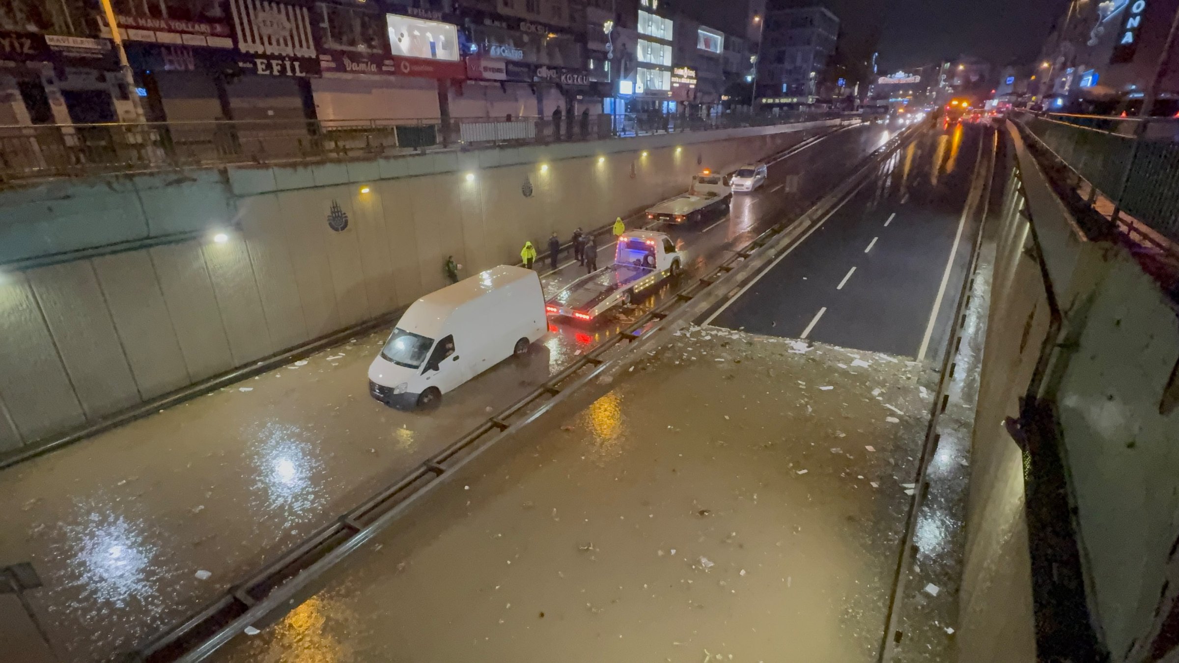A car remains stranded in floodwater on a street following torrential rain, Istanbul, Türkiye, Oct. 14, 2026. (AA Photo)