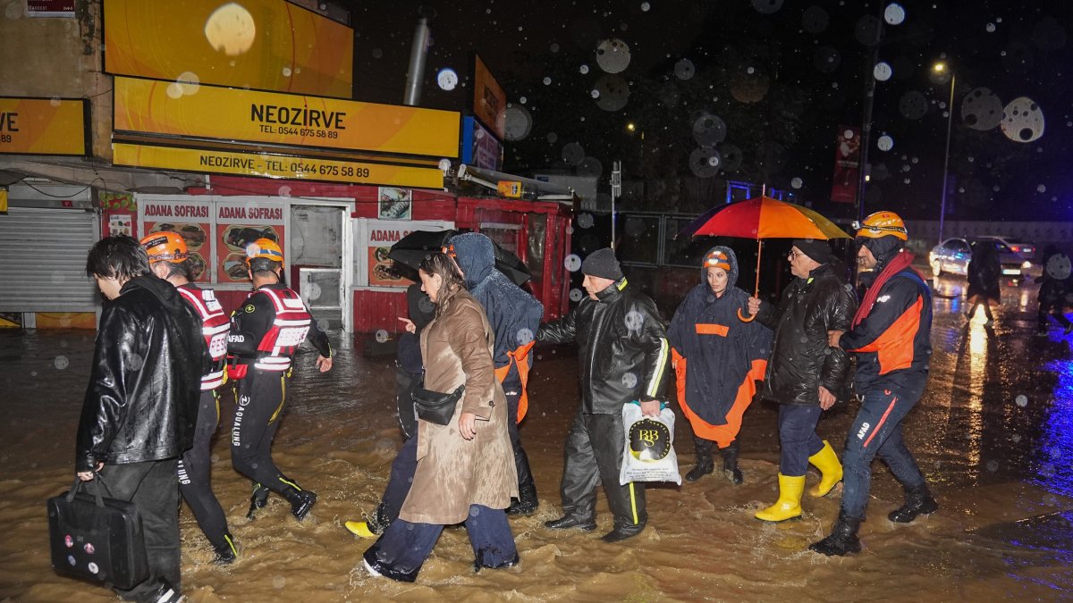 People walk through floodwater after torrential rain, Istanbul, Türkiye, Oct. 14, 2026. (AA Photo)