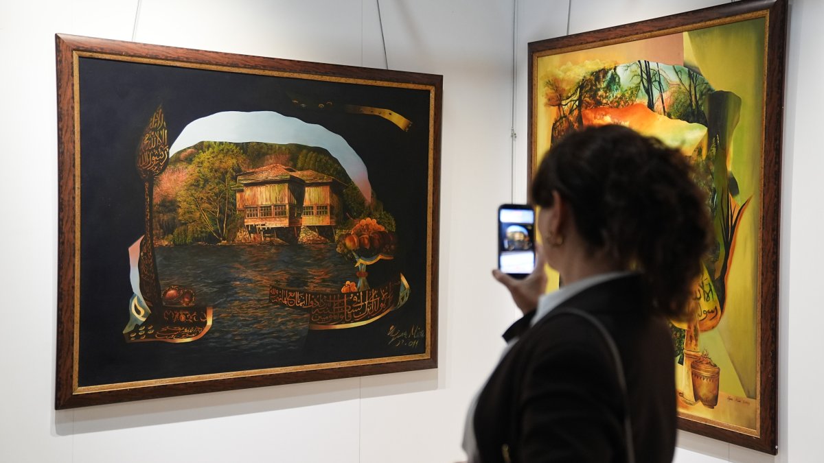 A visitor takes a photo of a painting at the “Legacy of the Past: From Traces to Horizons” exhibition at the Palace Collections Museum in Dolmabahçe Palace, Istanbul, Türkiye, Oct. 14, 2026. (AA Photo)