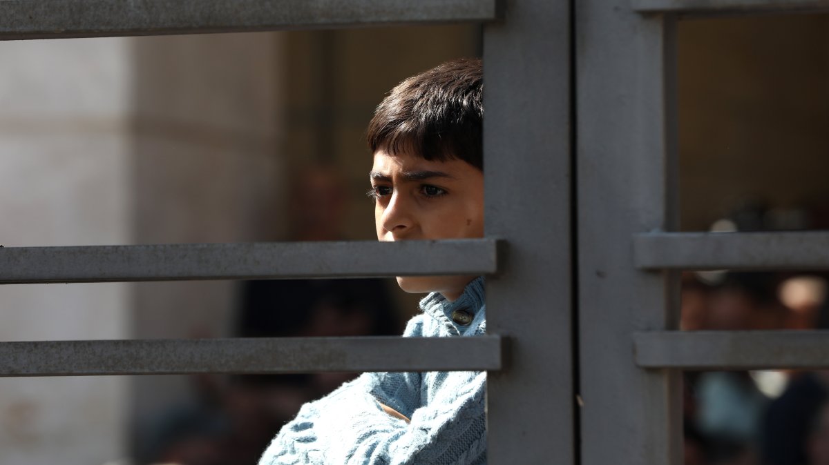 A Palestinian child watches as Palestinians freed from Israeli prisons arrive in a bus to Ramallah, Palestine, Oct. 13, 2025. (Getty Images Photo)