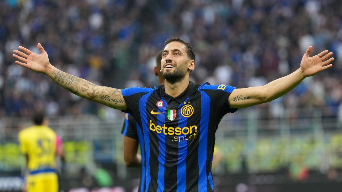 Inter Milan's Hakan Çalhanoğlu celebrates after scoring his side's second goal during the Serie A match against Parma, Milan, Italy, Oct. 10, 2026. (AP Photo)