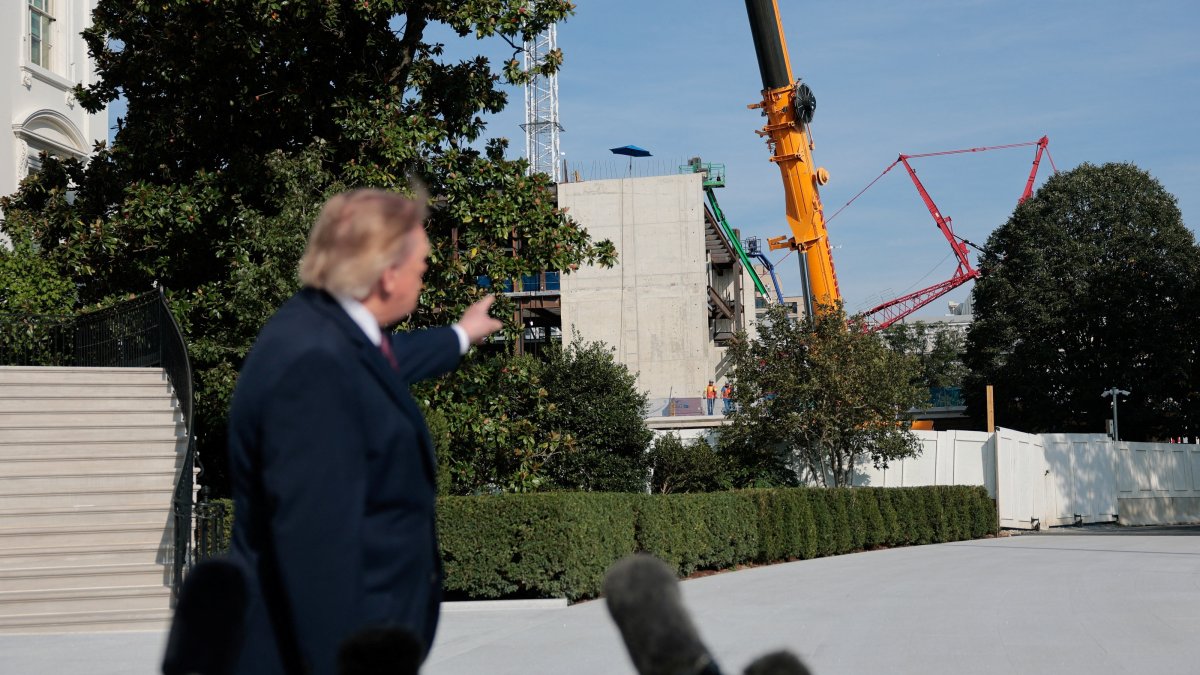 U.S. President Donald Trump points to the construction site of the White House ballroom as he speaks with the media before boarding Marine One on the South Lawn of the White House in Washington, D.C., U.S., Oct. 2, 2026. (Reuters Photo)