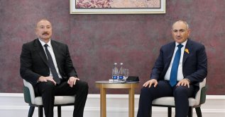 Azerbaijani President Ilham Aliyev speaks with Armenian Prime Minister Nikol Pashinyan on the sidelines of the Shanghai Cooperation Organization Summit, Bishkek, Kyrgyzstan, Aug. 31, 2026. (AP Photo)