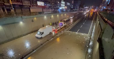 A car remains stranded in floodwater on a street following torrential rain, Istanbul, Türkiye, Oct. 14, 2026. (AA Photo)