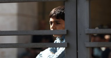 A Palestinian child watches as Palestinians freed from Israeli prisons arrive in a bus to Ramallah, Palestine, Oct. 13, 2025. (Getty Images Photo)