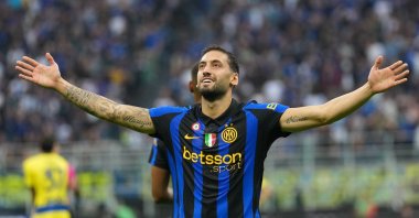Inter Milan's Hakan Çalhanoğlu celebrates after scoring his side's second goal during the Serie A match against Parma, Milan, Italy, Oct. 10, 2026. (AP Photo)