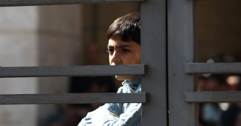A Palestinian child watches as Palestinians freed from Israeli prisons arrive in a bus to Ramallah, Palestine, Oct. 13, 2025. (Getty Images Photo)