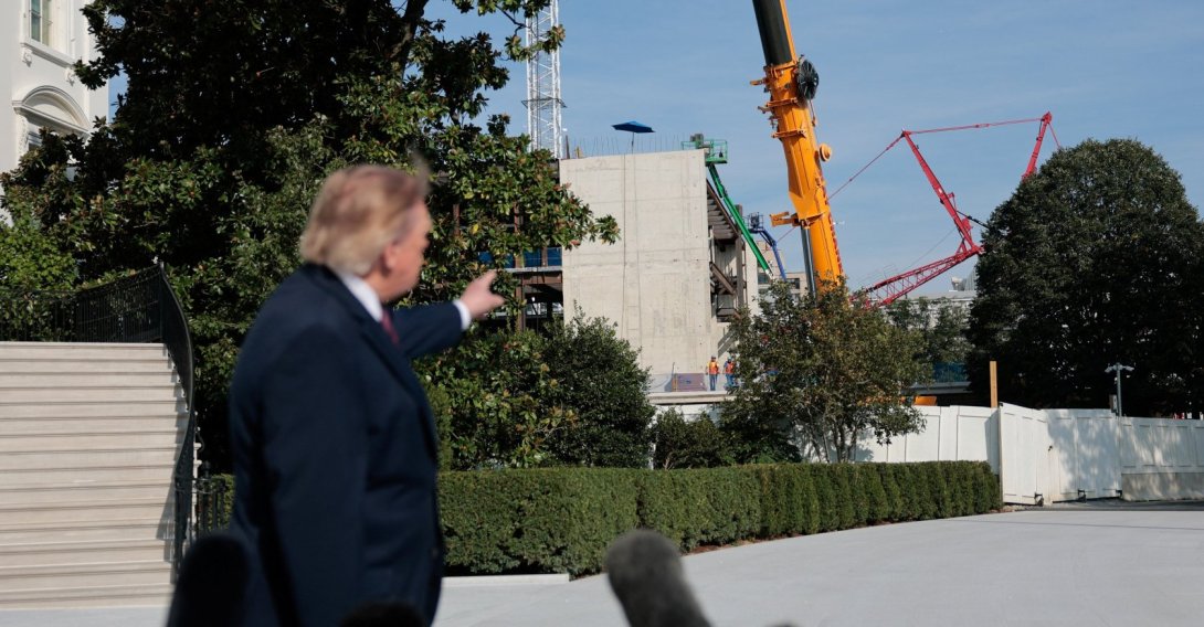 U.S. President Donald Trump points to the construction site of the White House ballroom as he speaks with the media before boarding Marine One on the South Lawn of the White House in Washington, D.C., U.S., Oct. 2, 2026. (Reuters Photo)