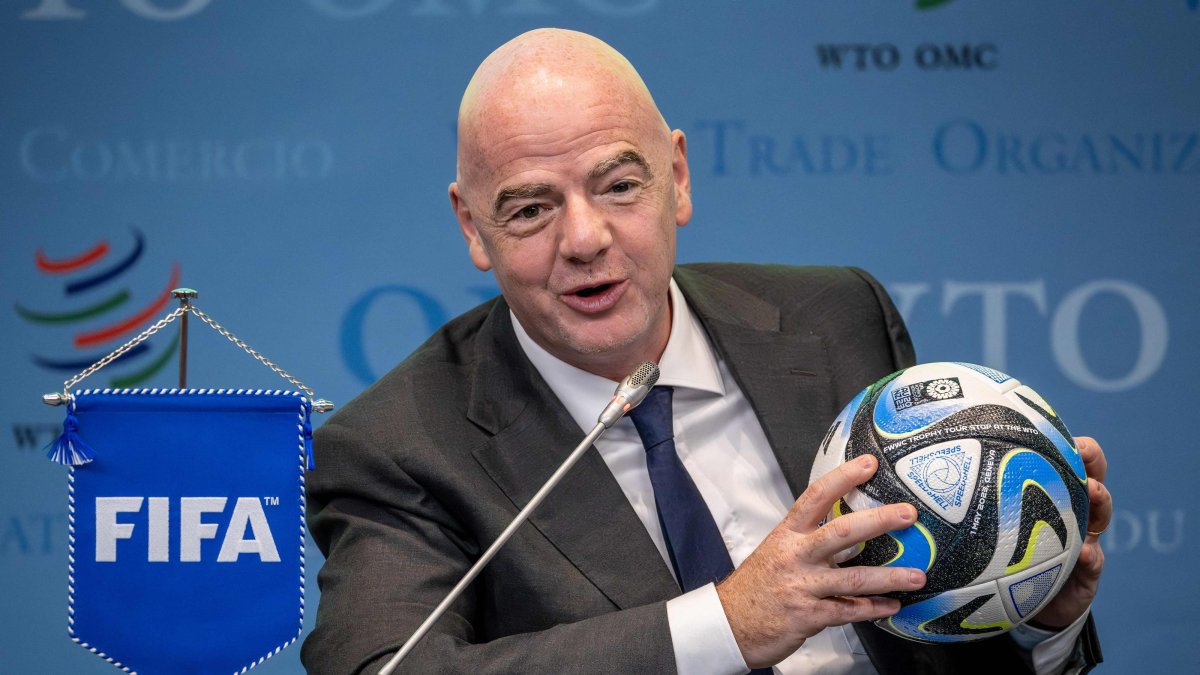 FIFA President Gianni Infantino holds an official ball of the 2023 FIFA Women's World Cup during the "Making trade score for women!" discussion on the use of football as a tool for trade and development at the WTO headquarters, Geneva, Switzerland, May 1, 2023. (AFP Photo)