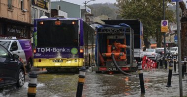 Drivers navigate floodwaters along the Beykoz coast as teams work to clear the road following heavy rainfall, Istanbul, Türkiye, Oct. 15, 2026. (AA Photo)