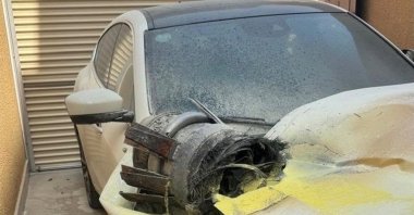 This handout picture provided by the Saudi Press Agency (SPA) shows the remains of a projectile on top of a damaged vehicle found by civil defence responders checking damage at an apartment building, Riyadh, Saudi Arabia, Oct. 14, 2026. (AFP Photo)