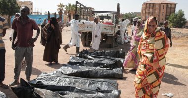 Relatives check the body bags of victims of Sudan’s two-year conflict after the Sudanese Red Crescent transferred the remains from makeshift graves to a local cemetery, Khartoum, Sudan, Jan. 11, 2026. (AP File Photo)