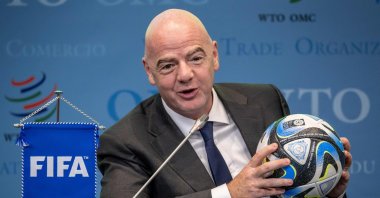 FIFA President Gianni Infantino holds an official ball of the 2023 FIFA Women's World Cup during the "Making trade score for women!" discussion on the use of football as a tool for trade and development at the WTO headquarters, Geneva, Switzerland, May 1, 2023. (AFP Photo)