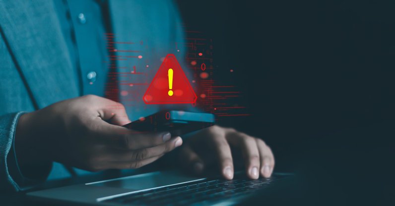 An illustration showing a system hacked warning alert on a laptop/phone. (Shutterstock Photo)