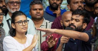Abhijeet Dipke (R), founder of the Cockroach Janata Party (CJP), and Neha Bora, national president of the All India Students' Association (AISA), gesture as they address a press conference, New Delhi, India, Oct. 15, 2026. (Reuters Photo)