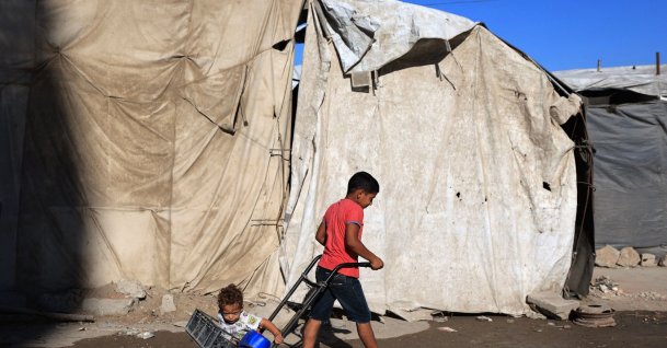 Children of displaced Palestinians play outside their temporary tent, Gaza City, Palestine, Oct. 7, 2026. (AFP Photo)