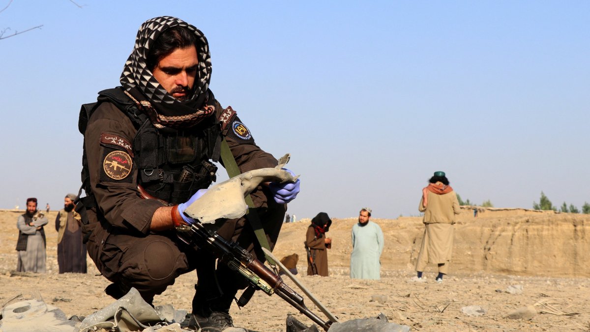 A member of the Taliban security forces inspects metal debris at the site of a partially damaged house following what Taliban officials say was a Pakistani airstrike in Gurbuz district, Khost province, Afghanistan, Sept. 24, 2026. (Reuters Photo)