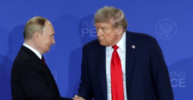 U.S. President Donald Trump and Russian President Vladimir Putin shake hands during a press conference following their meeting to negotiate an end to the war in Ukraine, at Joint Base Elmendorf-Richardson in Anchorage, Alaska, U.S., Aug. 15, 2025. (Reuters Photo)