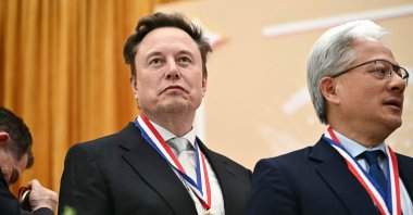 SpaceX CEO Elon Musk (L) and Nvidia CEO Jensen Huang react after being awarded the National Medal of Science, Washington, U.S., Oct. 8, 2026. (AFP Photo)