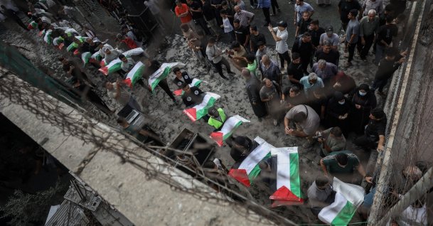 People carry the remains of Palestinians, who died under the rubble of a building destroyed in Israeli war on Gaza, for a funeral, Oct. 18, 2026. (AA Photo)