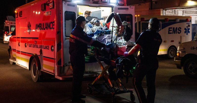 Paramedics load an injured person into an ambulance at the Wainwright Health Centre as injured military members are treated after a fire at Canadian Forces Base Wainwright, Alberta, Canada, Oct. 17, 2026. (AP Photo)