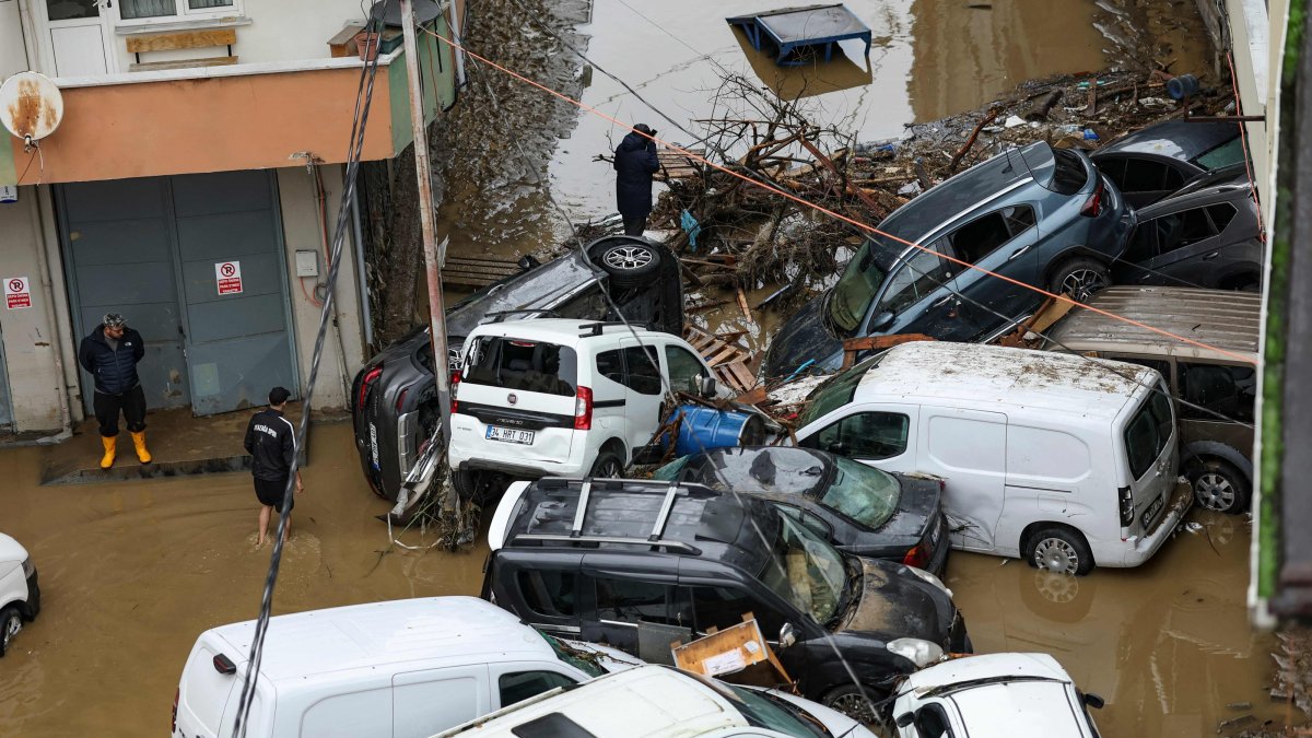 Car owners search for their vehicles swept away by the flood after heavy rain in the Ayazağa district, Istanbul, Türkiye, Oct. 15, 2026. (AFP Photo)