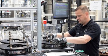 A worker assembles axial-flux motors for electric vehicles on an assembly line at the Mercedes-Benz engine factory, Berlin, Germany, June 9, 2026. (Reuters Photo)