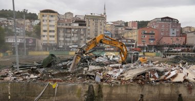 An excavator removes debris from demolished structures along a streambed, Ayazağa, Istanbul, Türkiye, Oct. 18, 2026. (AA Photo)