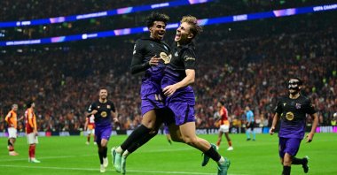 Barcelona's Spanish midfielder Fermin Lopez (R) celebrates with Lamine Yamal (L) after scoring a goal in UEFA Champions League match against Galatasaray, in Istanbul, Oct. 13, 2026. (AFP Photo)