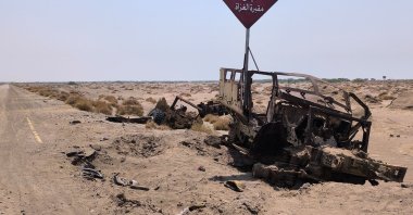 Destroyed military vehicles reportedly belonging to Saudi-backed forces sit along a road following fighting between Houthi fighters and the Saudi-led coalition near Mokha, Yemen, Oct. 17, 2026.(AFP Photo)