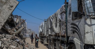 Humanitarian aid trucks drive across northern Gaza after entering through Zikim, April 13, 2026. (AFP Photo)