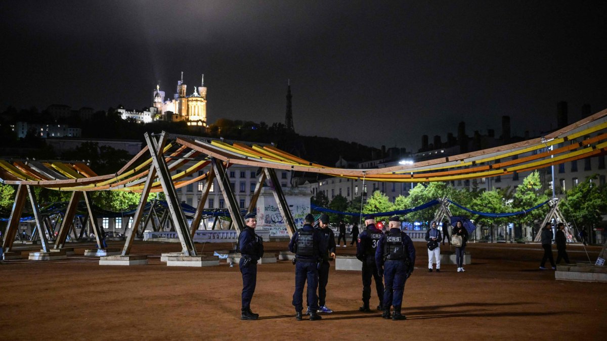 Police officers patrol during a partial curfew in Lyon, France, Oct. 19, 2026. (AFP Photo)