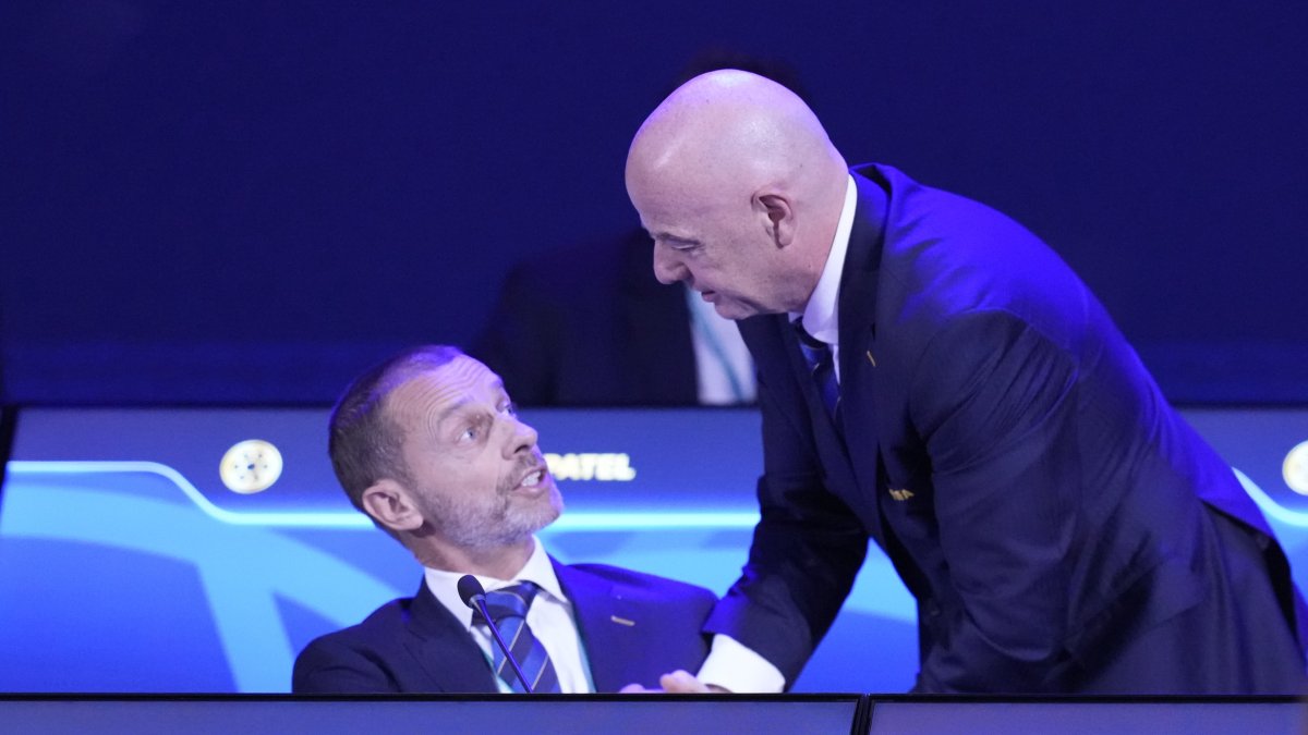 FIFA President Gianni Infantino (R) talks to UEFA President Aleksander Ceferin during the FIFA 75th Congress at the Conmebol Convention Center, Luque, Paraguay, May 15, 2025. (AP Photo)