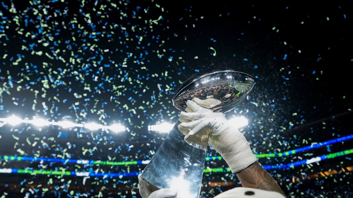 A member of the Seattle Seahawks celebrates with the Lombardi Trophy after defeating the New England Patriots in the NFL Super Bowl 60, Santa Clara, U.S., Feb. 8, 2026. (AP Photo)