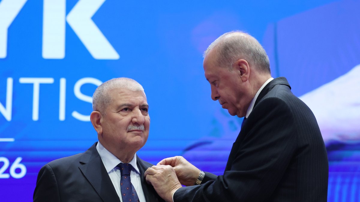 President Recep Tayyip Erdoğan presents the AK Party badge to Cemalettin Kani Torun, Ankara, Türkiye, Oct. 20, 2026. (AA Photo)