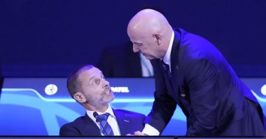 FIFA President Gianni Infantino (R) talks to UEFA President Aleksander Ceferin during the FIFA 75th Congress at the Conmebol Convention Center, Luque, Paraguay, May 15, 2025. (AP Photo)