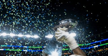 A member of the Seattle Seahawks celebrates with the Lombardi Trophy after defeating the New England Patriots in the NFL Super Bowl 60, Santa Clara, U.S., Feb. 8, 2026. (AP Photo)