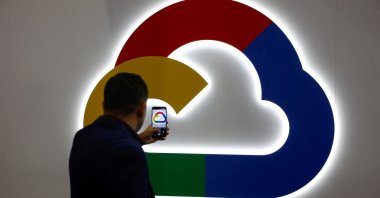 A person takes a photo of the Google Cloud logo during the 2025 Mobile World Congress (MWC) in Barcelona, Spain, March 4, 2025. (Reuters Photo)