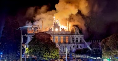 A fire engulfs City Hall after a group of people broke into the building during protests over the rising cost of living, Limoges, France, Oct. 17, 2026. (AFP Photo)