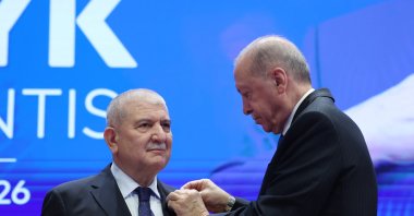 President Recep Tayyip Erdoğan presents the AK Party badge to Cemalettin Kani Torun, Ankara, Türkiye, Oct. 20, 2026. (AA Photo)