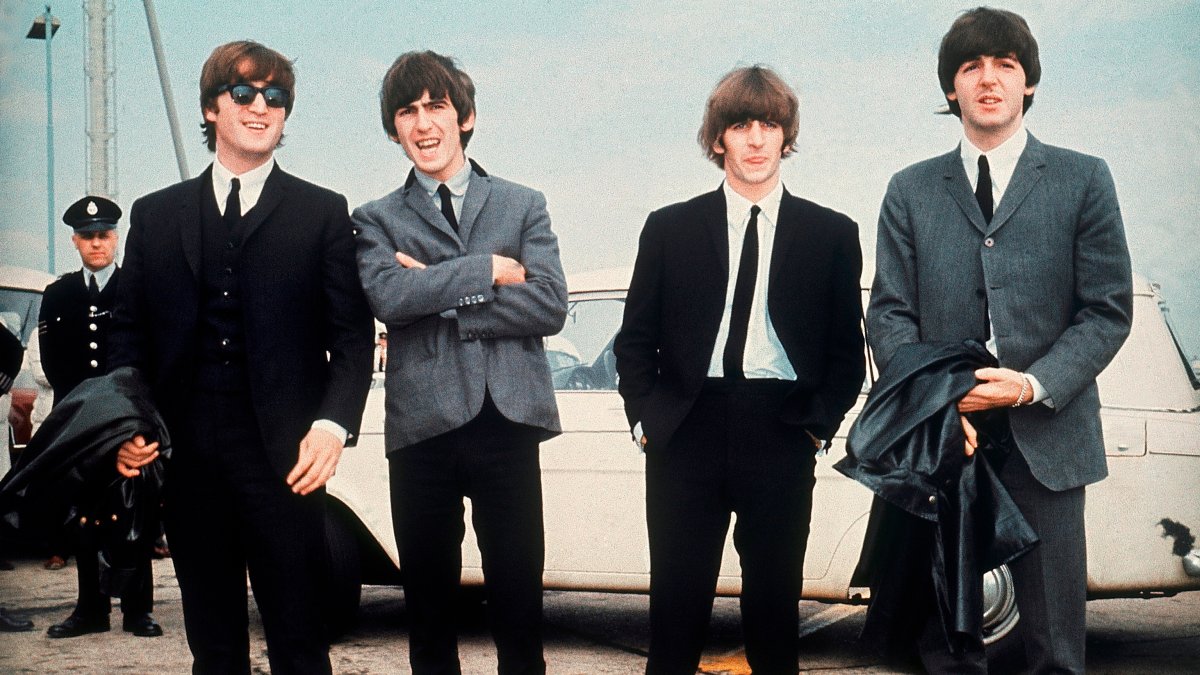 The Beatles (L-R) John Lennon, George Harrison, Ringo Starr and Paul McCartney arrive for the premiere of their movie "A Hard Day's Night," Liverpool, England, July 10, 1964. (AP Photo)
