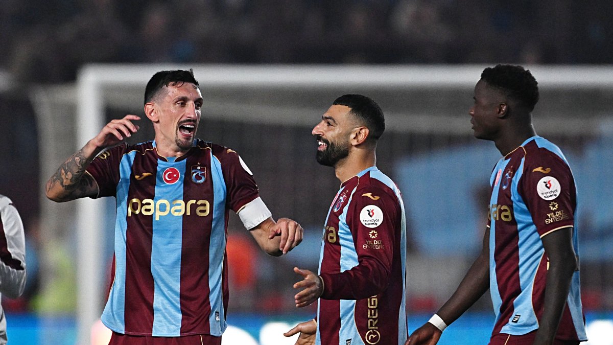 (L-R) Trabzonspor players Stefan Savic, Mohamed Salah and Franculino celebrate after a Süper Lig victory over Beşiktaş at Papara Park, Oct. 19, 2026. (AA Photo)