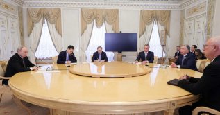 Russia's President Vladimir Putin (L), Kremlin foreign policy aide Yuri Ushakov (3rd L) and presidential envoy Kirill Dmitriev (R) attend a meeting with U.S. special envoy Steve Witkoff (2nd R) in Saint Petersburg, Oct. 21, 2026. (Handout via AFP)