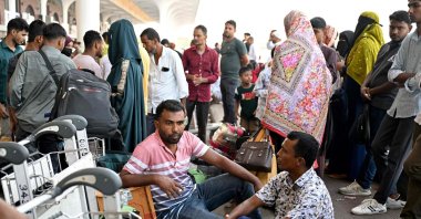 Saudi Arabia-bound passengers remain stranded at the Hazrat Shahjalal International Airport in Dhaka, Bangladesh, Oct. 12, 2026. (AFP Photo)