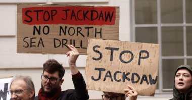 Demonstrators hold anti-Jackdaw placards as they demonstrate against further drilling for oil and gas in the North Sea, outside the Department for Energy Security and Net Zero in central London, U.K., Oct. 21, 2026. (AFP Photo)
