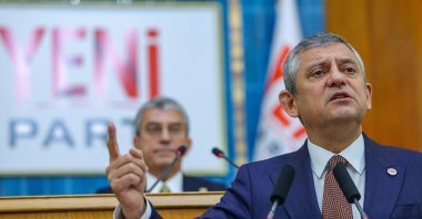 New Party (YP) Chairman Özgür Özel speaks at the parliamentary group meeting of his party, against the backdrop of a sign bearing the name of the party, Ankara, Türkiye, Oct. 20, 2026. (DHA Photo)
