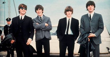 The Beatles (L-R) John Lennon, George Harrison, Ringo Starr and Paul McCartney arrive for the premiere of their movie "A Hard Day's Night," Liverpool, England, July 10, 1964. (AP Photo)