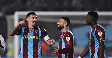 (L-R) Trabzonspor players Stefan Savic, Mohamed Salah and Franculino celebrate after a Süper Lig victory over Beşiktaş at Papara Park, Oct. 19, 2026. (AA Photo)
