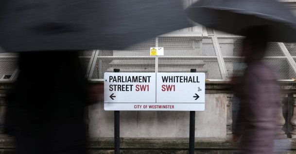 People walk past street signs in Whitehall, the centre of British government buildings in London, Britain, Oct. 21, 2026. (Reuters Photo)